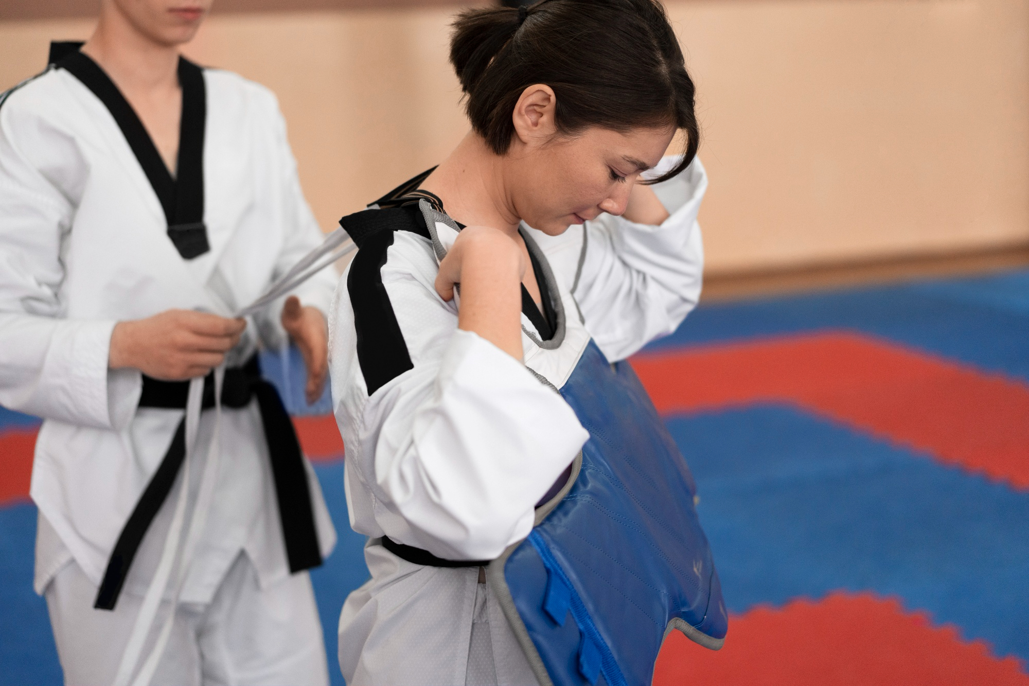 people-practicing-taekwondo-in-a-gymnasium-2.jpg