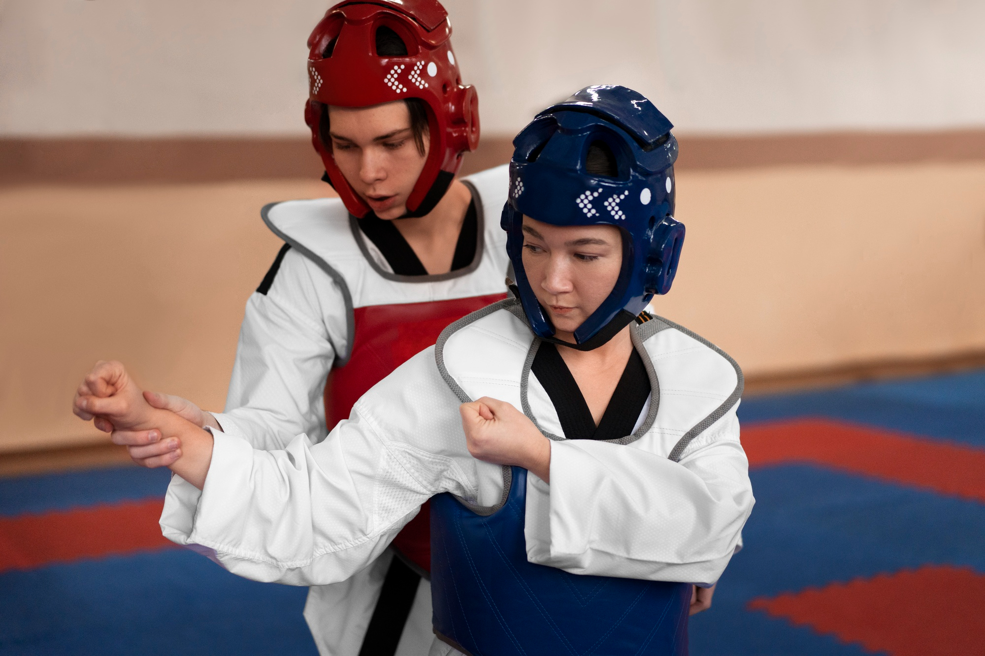 people-practicing-taekwondo-in-a-gymnasium-4.jpg